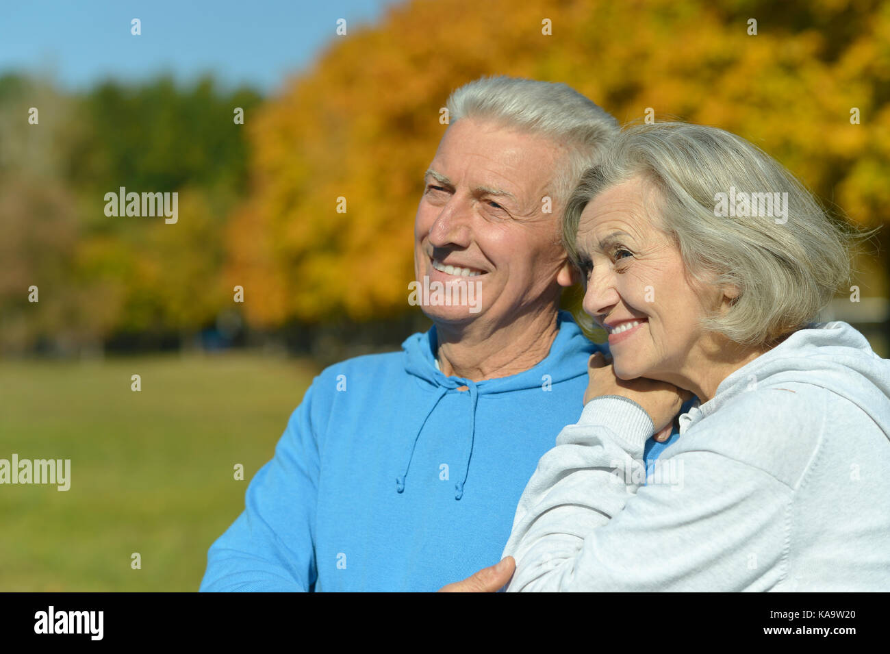 caucasian senior couple in the park Stock Photo - Alamy