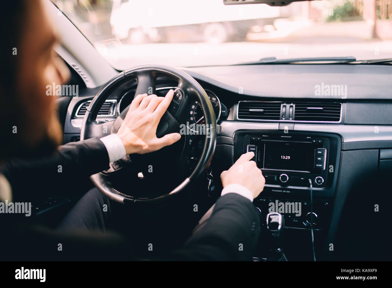 Car dashboard. Radio closeup. Man sets radio Stock Photo Alamy