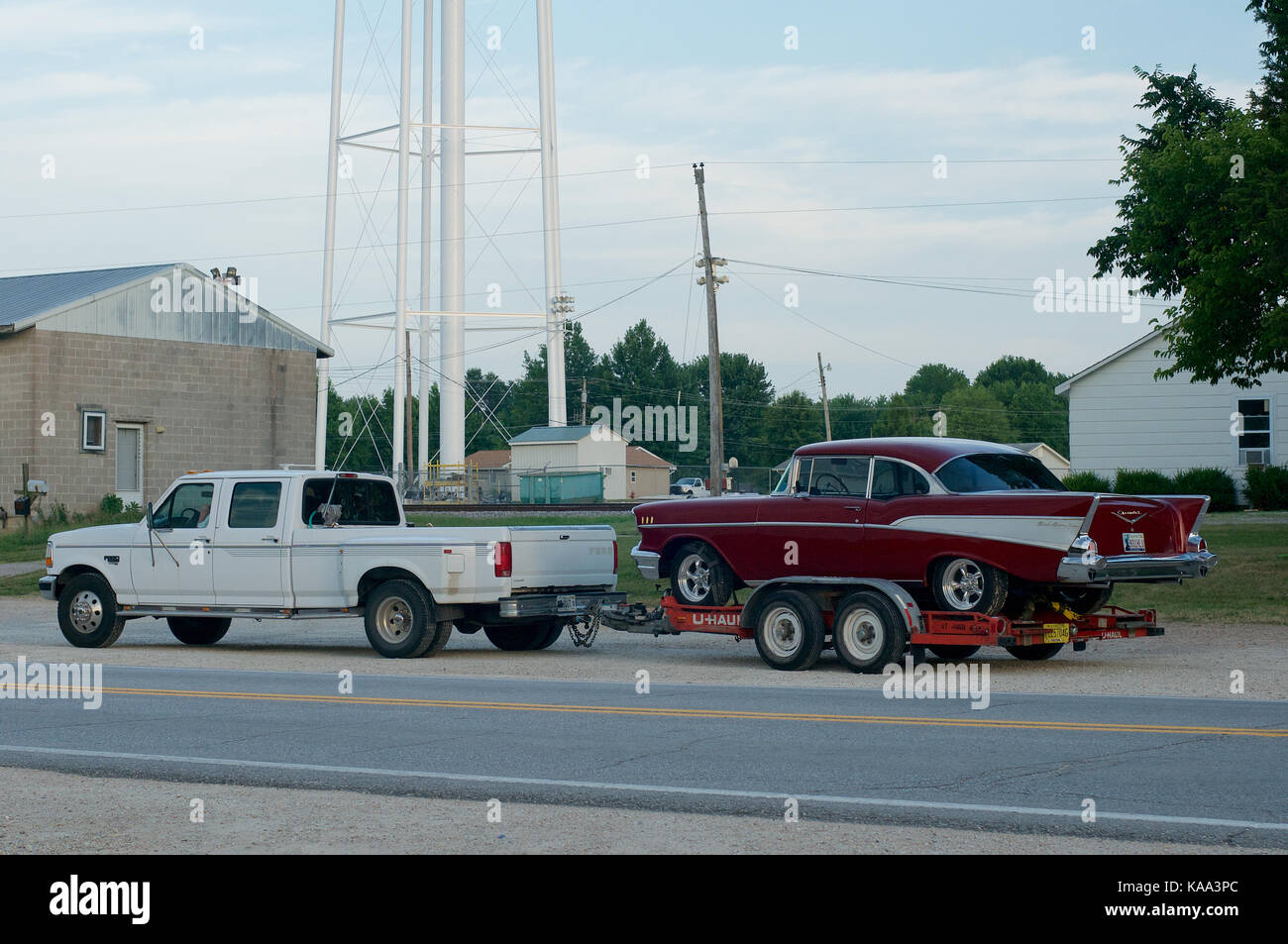 Pick-up truck towing a 1957 Chevrolet Bel Air in Cuba, Missouri, USA Stock Photo