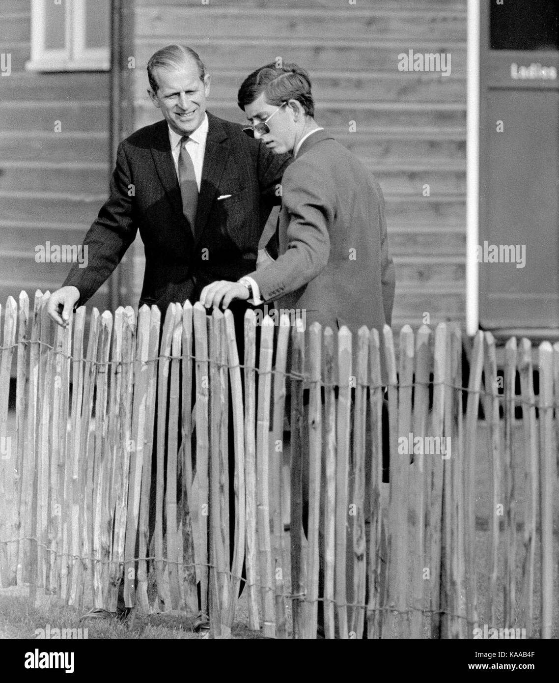 A father and son moment between Prince Charles (then aged 19yrs) and his father Prince Philip, Duke of Edinburgh. The young prince was seeking advice from his father during a polo match at Cowdray Park in West Sussex. (An exclusive image copyright David Cole from the archives of Press Portrait Service) Stock Photo