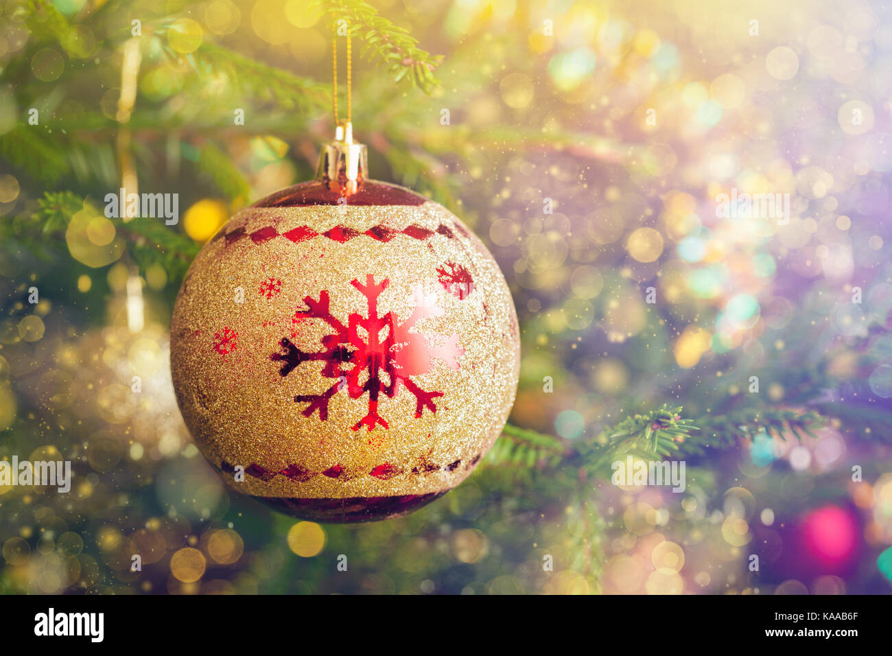 Christmas-tree decoration bauble on decorated Christmas tree bac Stock Photo