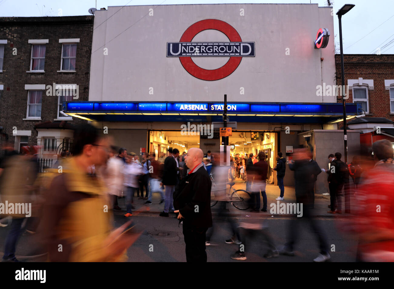 Fans arrive Arsenal tube station before the Premier League match at the