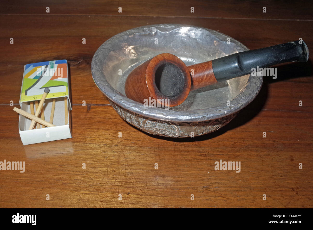 Tobacco pipe with a box of matches and ashtray Stock Photo Alamy