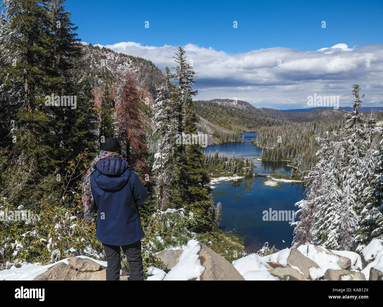 Tourist sees Twin Lakes from overlook at Mammoth Lakes Basin in Mammoth Lakes in the Eastern Sierra in California Stock Photo