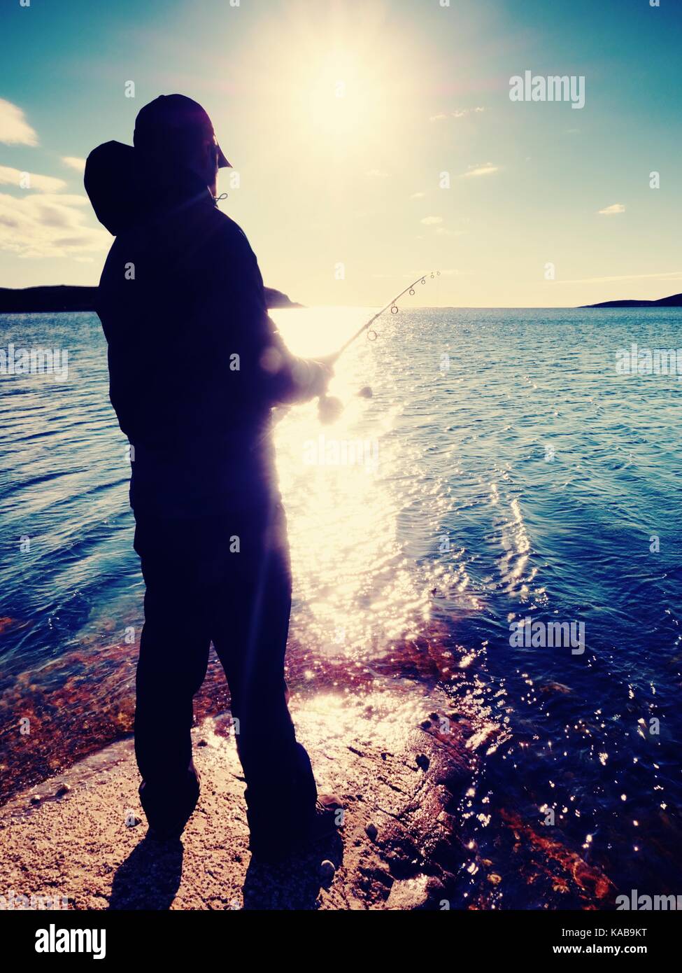 Fisherman check fishing line and pushing bait on the rod, prepare