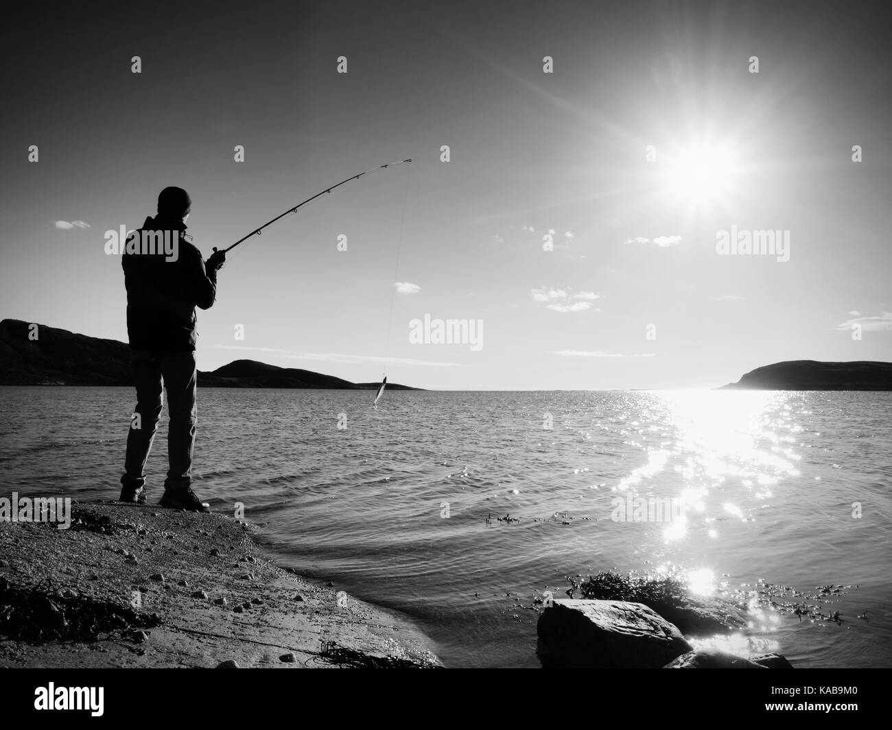 Fisherman check fishing line and pushing bait on the rod, prepare