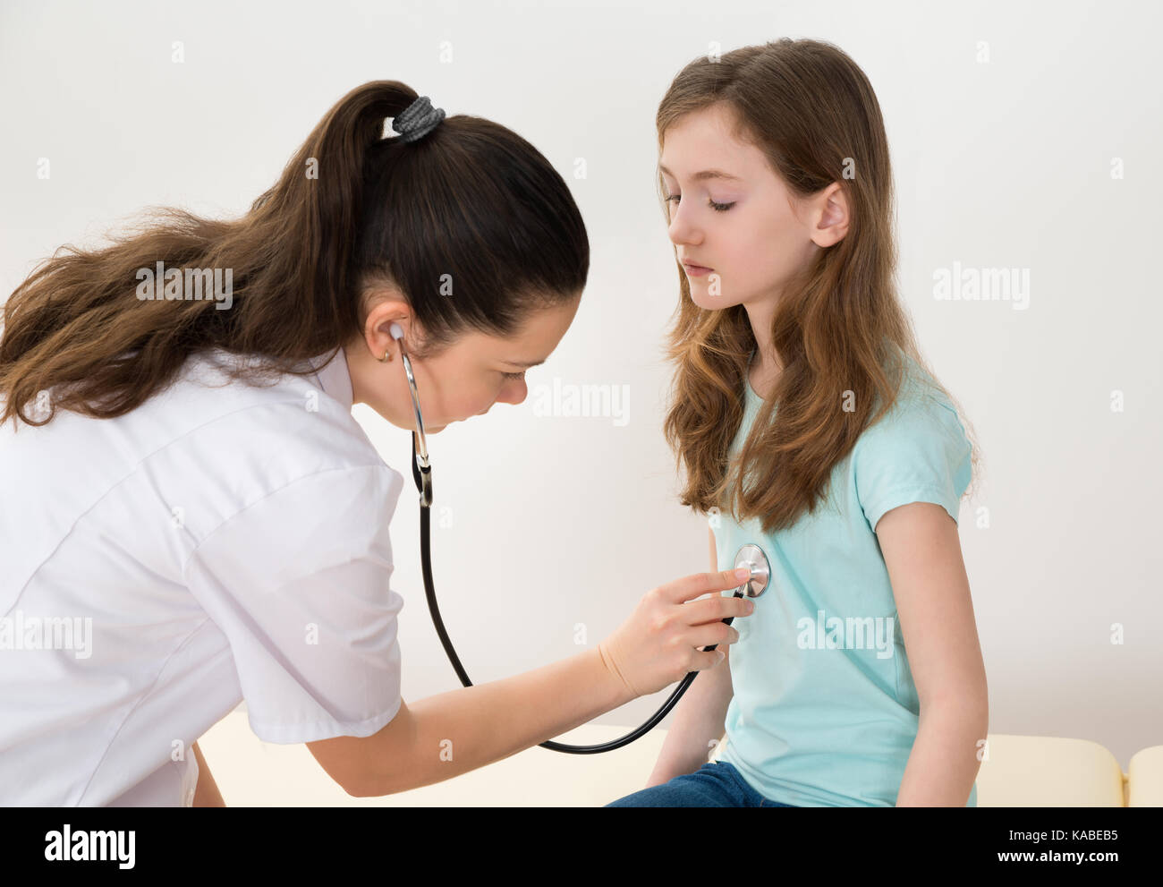 Young Female Doctor Examine Male Patient Stock Photo 