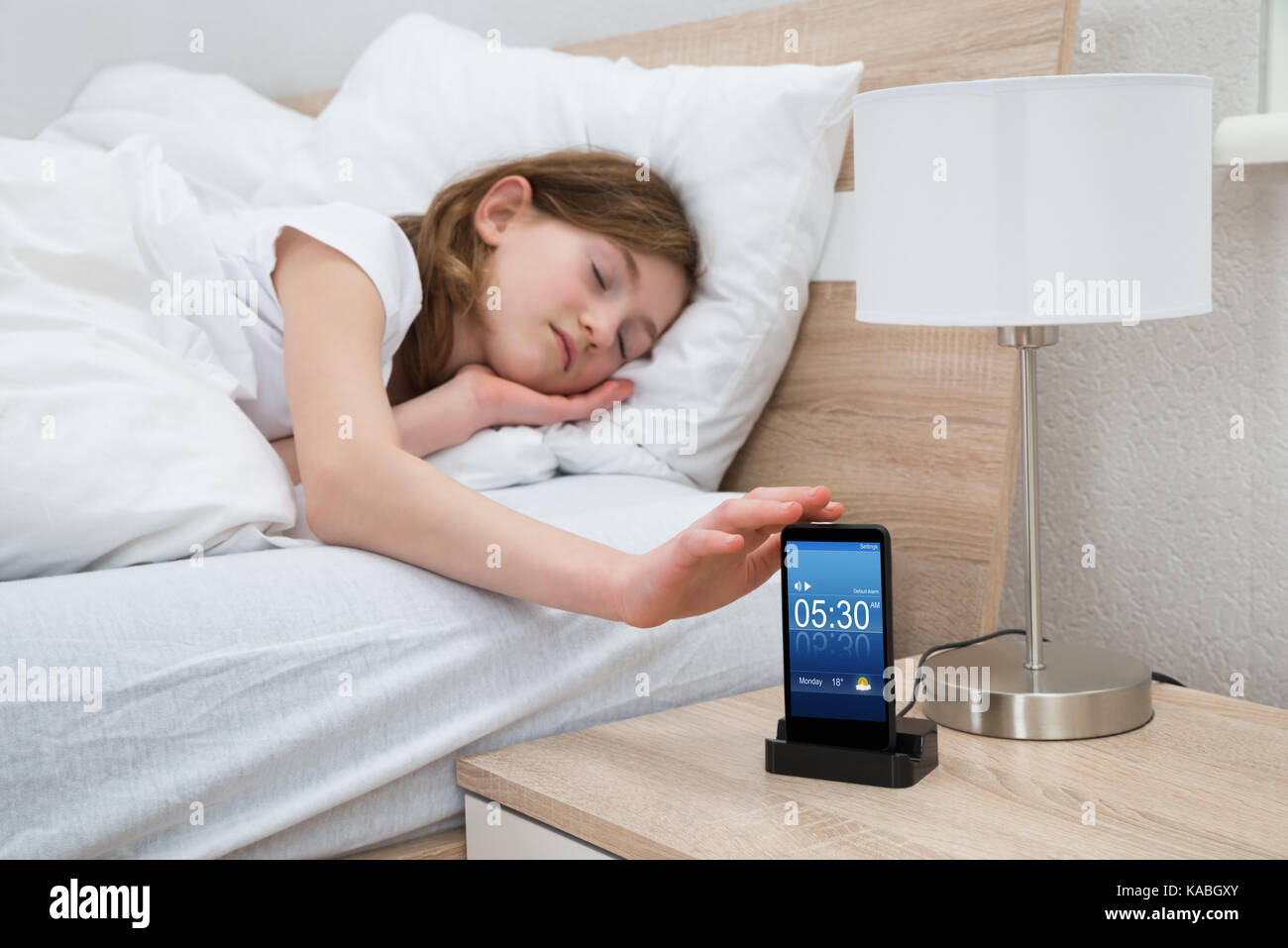 Child in bed sleep timer lamp hires stock photography and images Alamy