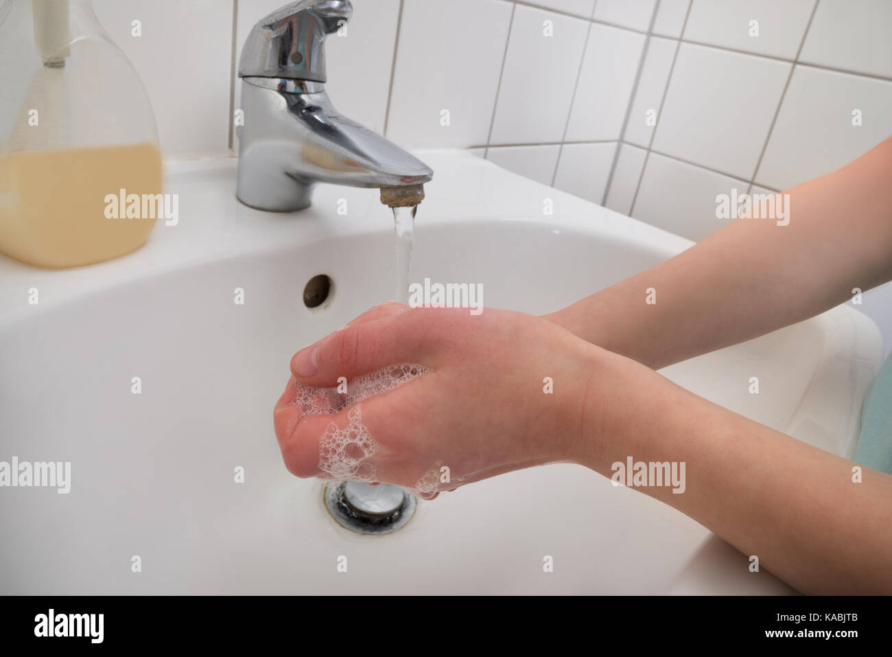 Close up Of Person Hands Washing With Soap In Sink Stock Photo Alamy close-up-of-person-hands-washing-with-soap-in-sink-stock-photo-alamy