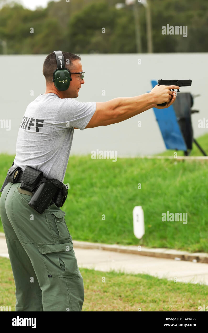 Sheriff's deputy shoots at the gun range at the law enforcement training center used by police officers, and sheriff's deputies, USA. Stock Photo