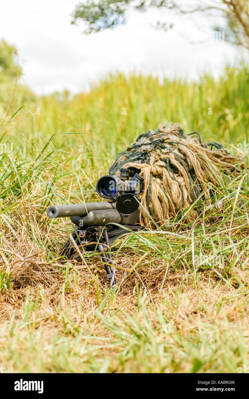 camouflaged sniper rifle with scope Stock Photo - Alamy