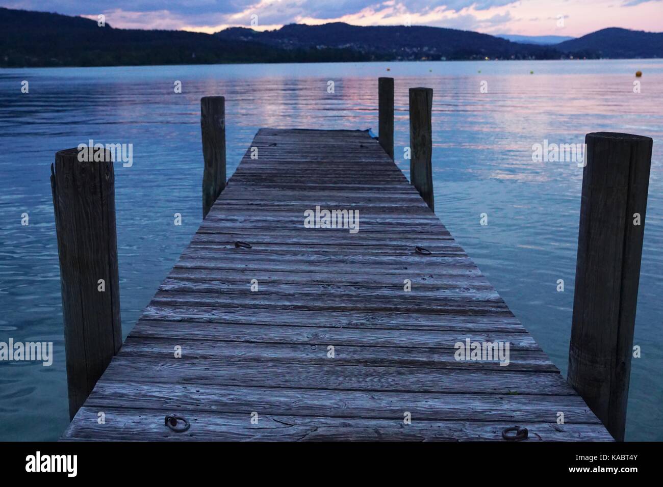 Jetty on the lake at sunset - Klagenfurt, Austria Stock Photo