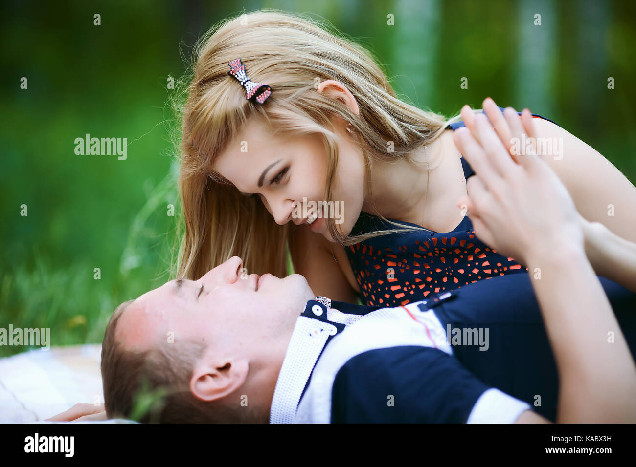 Happy young couple looking at each other Stock Photo - Alamy