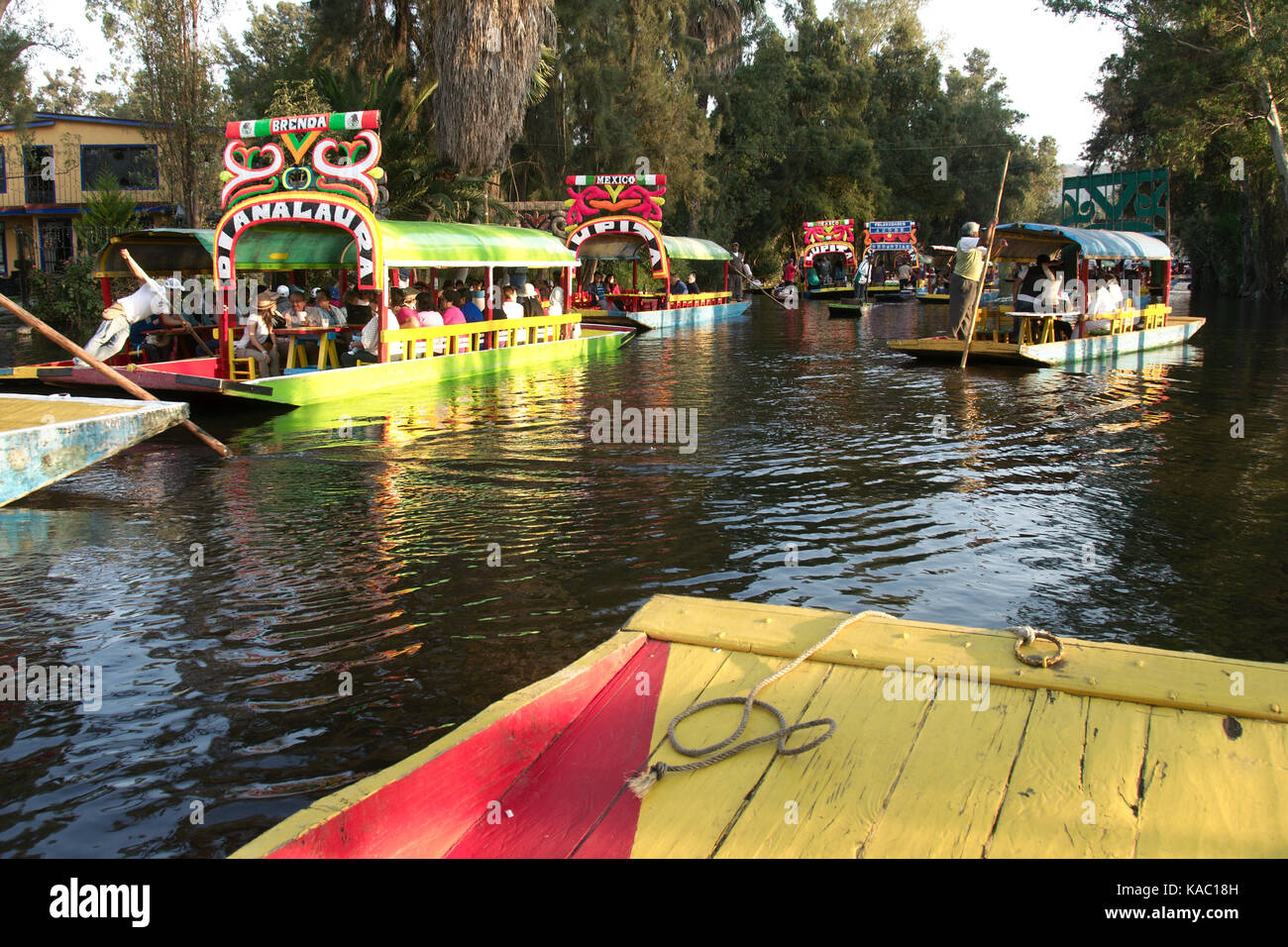 Xochimilco, Mexico City, Mexico - 2016: Trajinera boats fulll of people on a weekend. Stock Photo