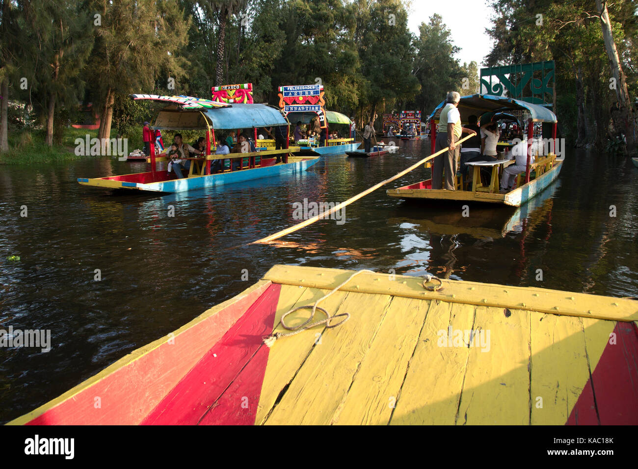 Xochimilco, Mexico City, Mexico - 2016: Trajinera boats fulll of people on a weekend. Stock Photo