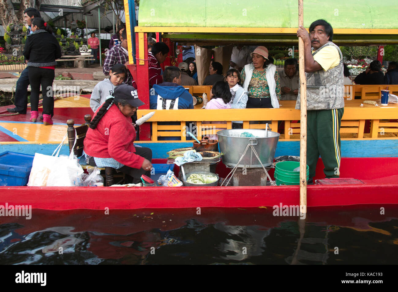 Xochimilco, Mexico City, Mexico - 2016: A fmily sells food on a trajinera boat. Stock Photo