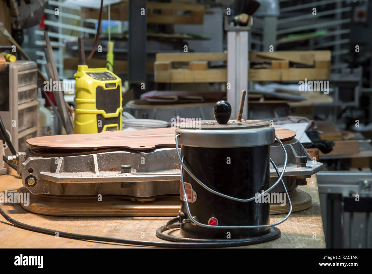 Close up of hot glue on assembly components of acoustic wooden guitar