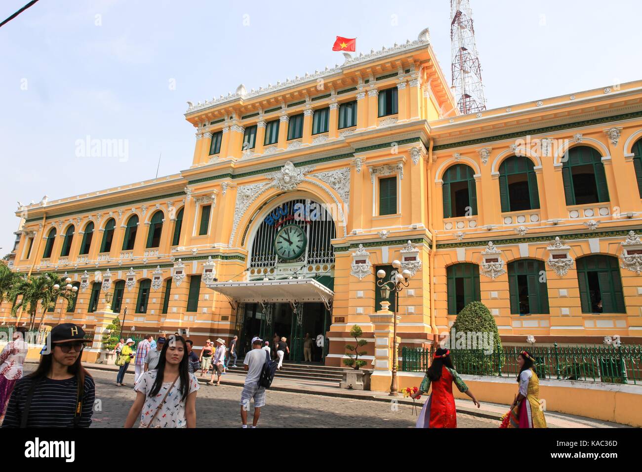 Saigon, Vietnam, January, 20, 2015. People walking near the Saigon Post Office Stock Photo