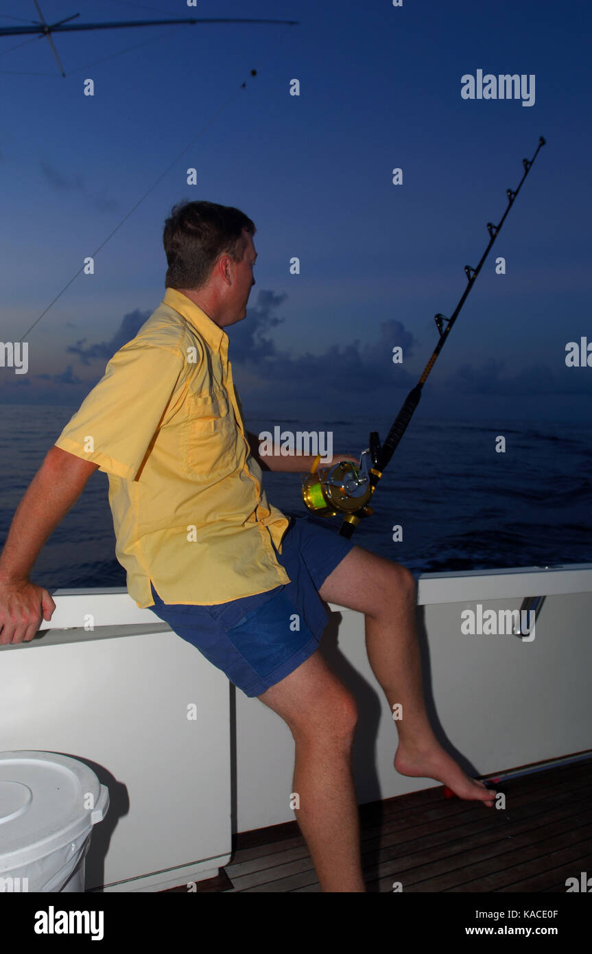 Man rigging deep sea fishing hi-res stock photography and images - Alamy