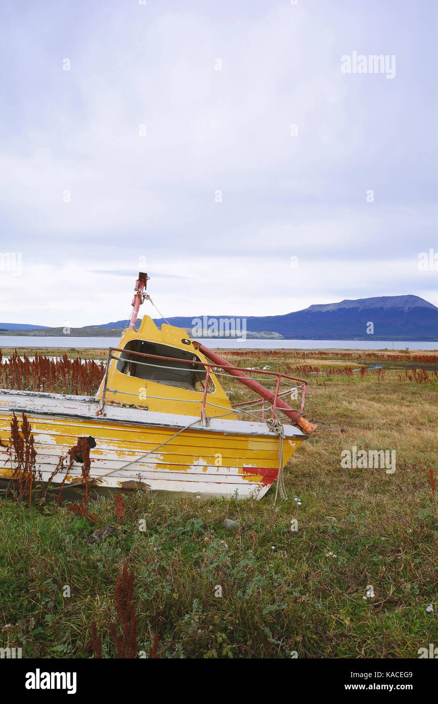 Old wooden boat abandoned ashore Stock Photo - Alamy
