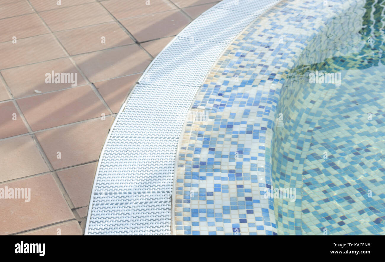 Blue swimming pool on hot sunny day on summer vacation Stock Photo - Alamy