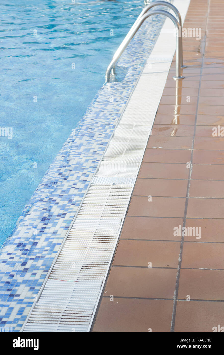 Blue swimming pool on hot sunny day on summer vacation Stock Photo - Alamy