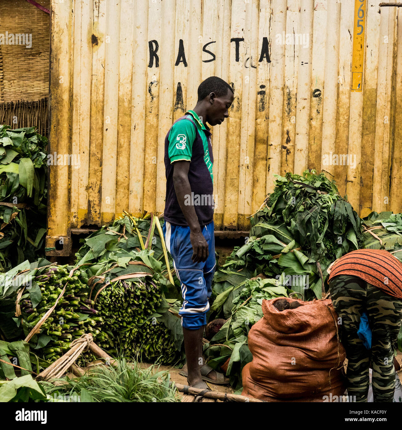 Ari tribe seller in front of a container at Jinka market, Omo Valley, Ethiopia Stock Photo