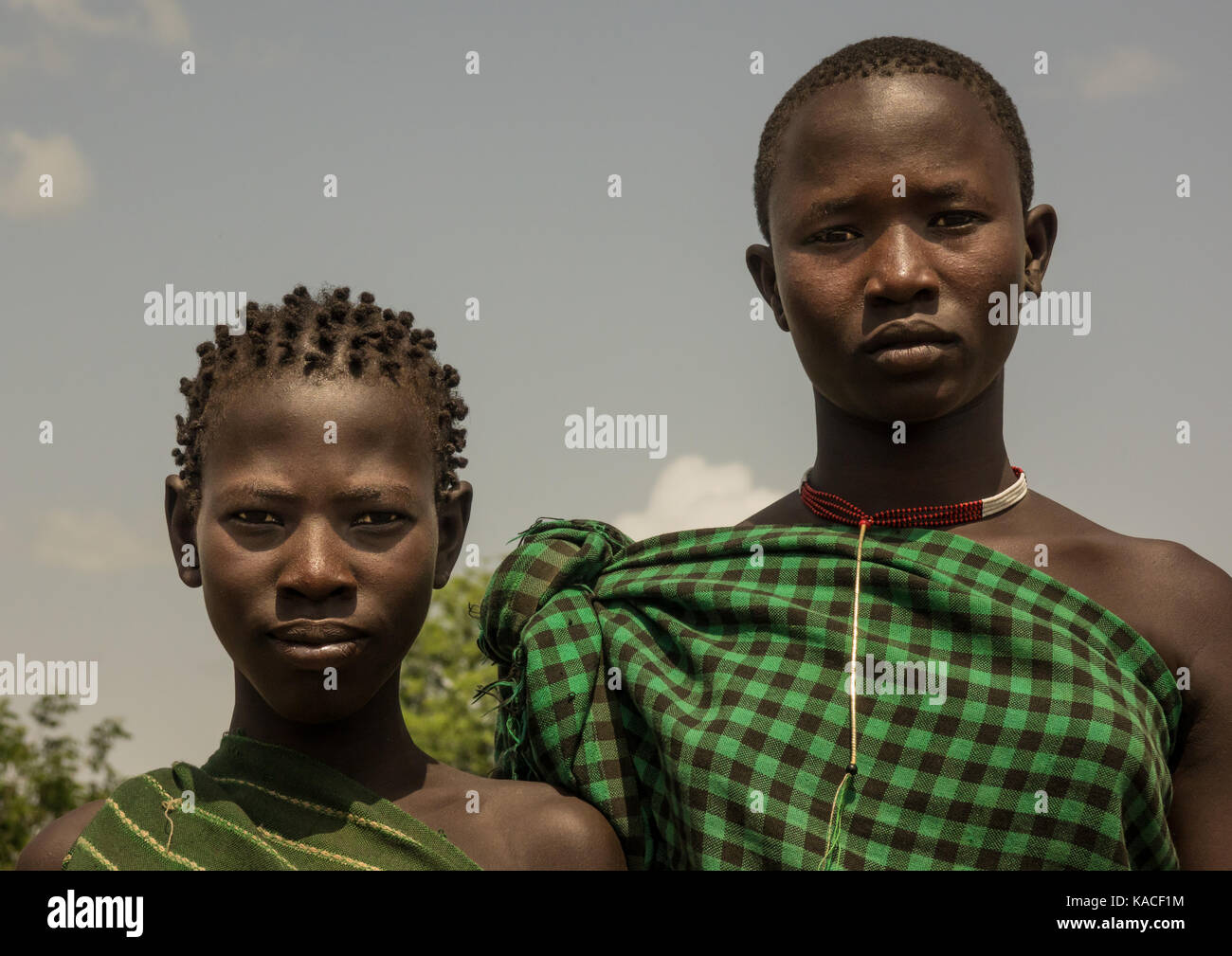 Bodi girls attending Kael ceremony, Gurra, Omo Valley, Ethiopia Stock Photo