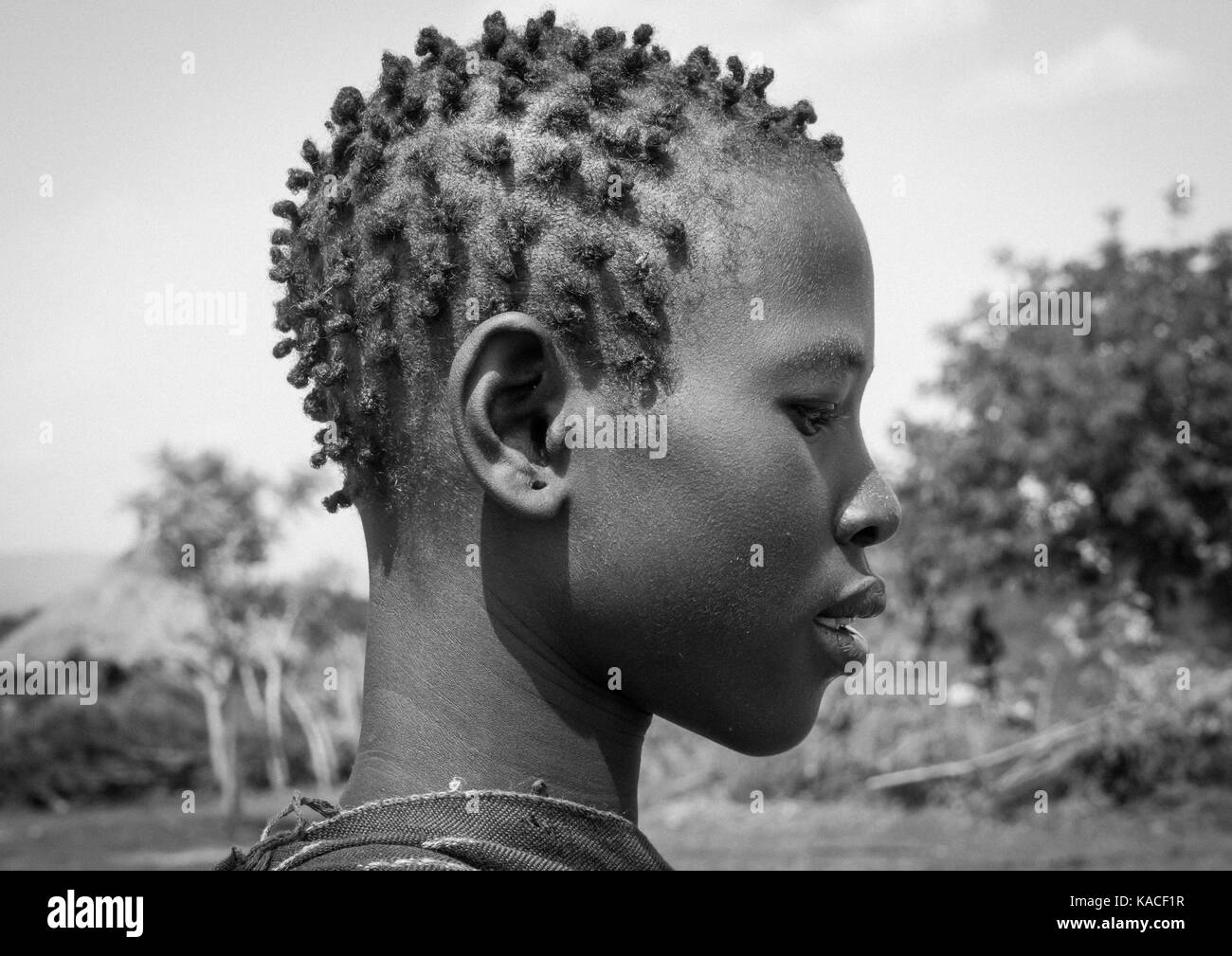 Bodi girl attending Kael ceremony, Gurra, Omo Valley, Ethiopia Stock Photo