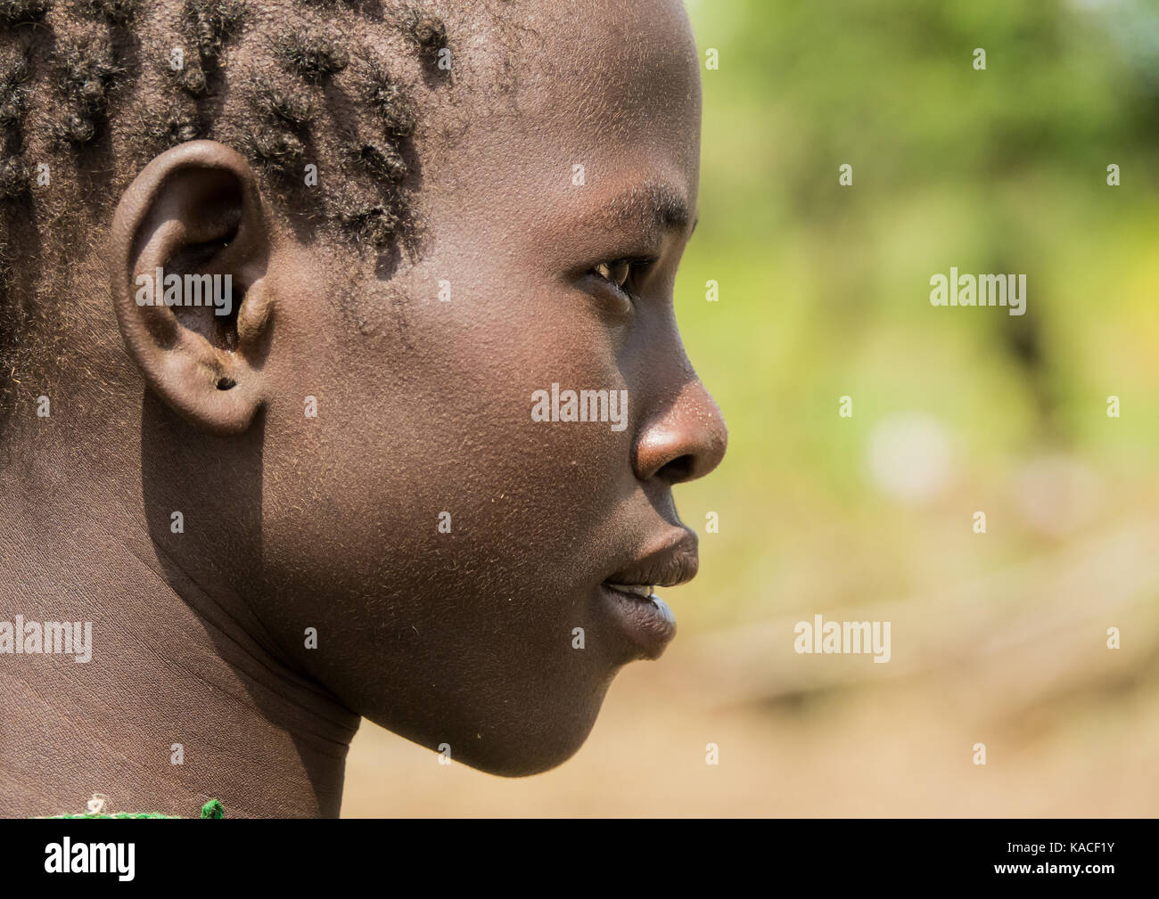 Bodi girl attending Kael ceremony, Gurra, Omo Valley, Ethiopia Stock Photo