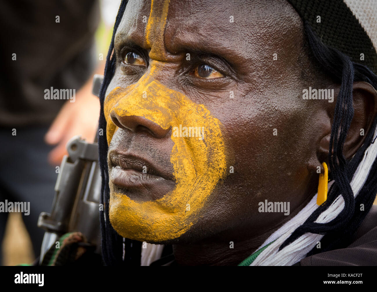 Man with make up attending Kael, fat men ceremony at Bodi tribe, Gurra, Omo Valley, Ethiopia Stock Photo