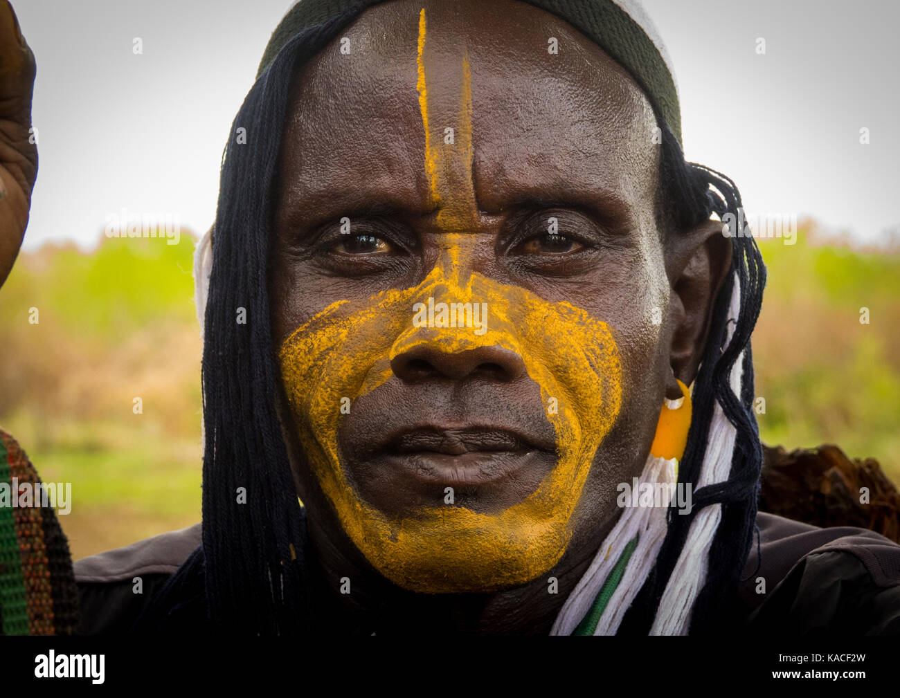 Man with make up attending Kael, fat men ceremony at Bodi tribe, Gurra, Omo Valley, Ethiopia Stock Photo