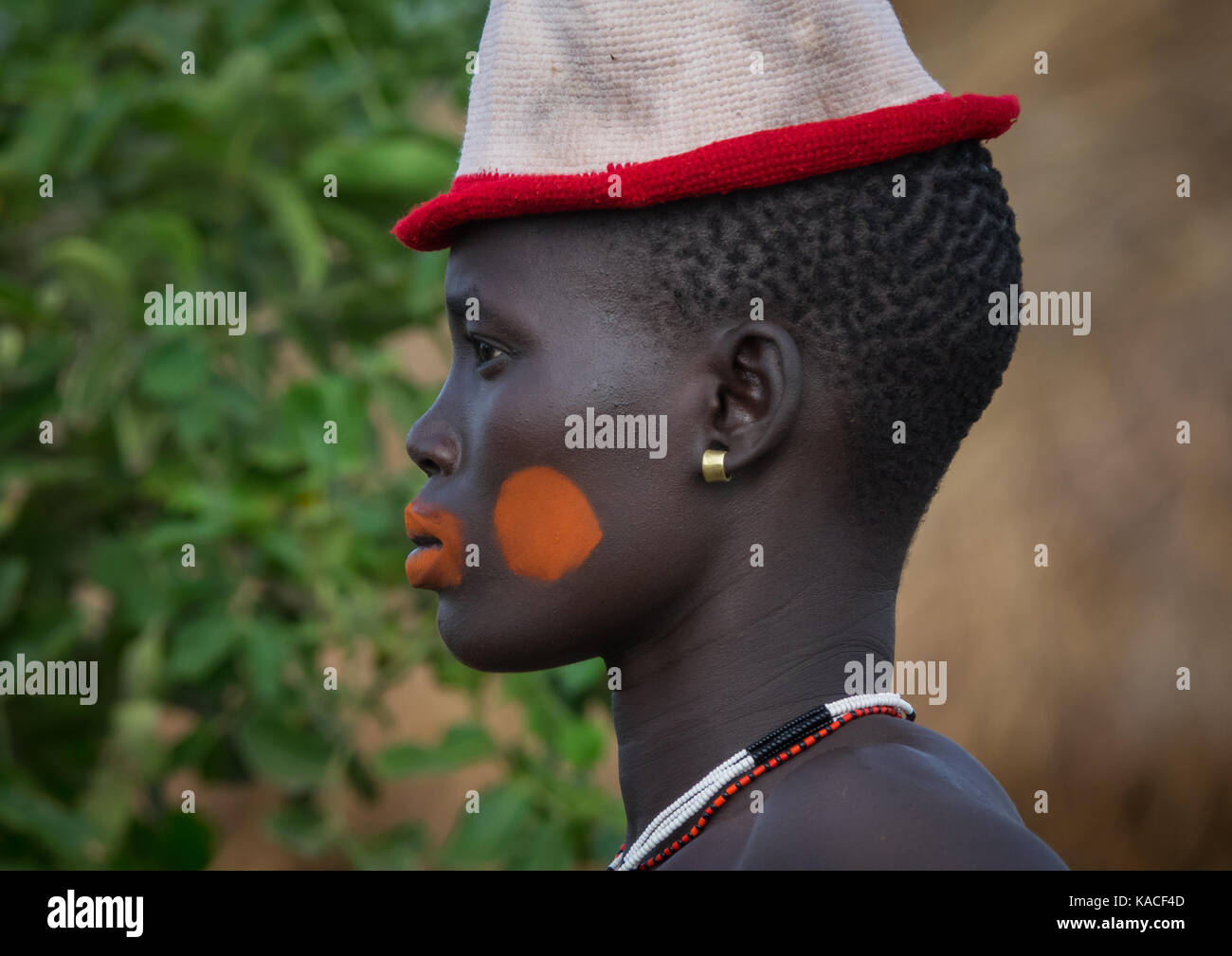 Stylish girl attending Kael ceremony, Gurra, Hana Mursi, Omo Valley, Ethiopia Stock Photo
