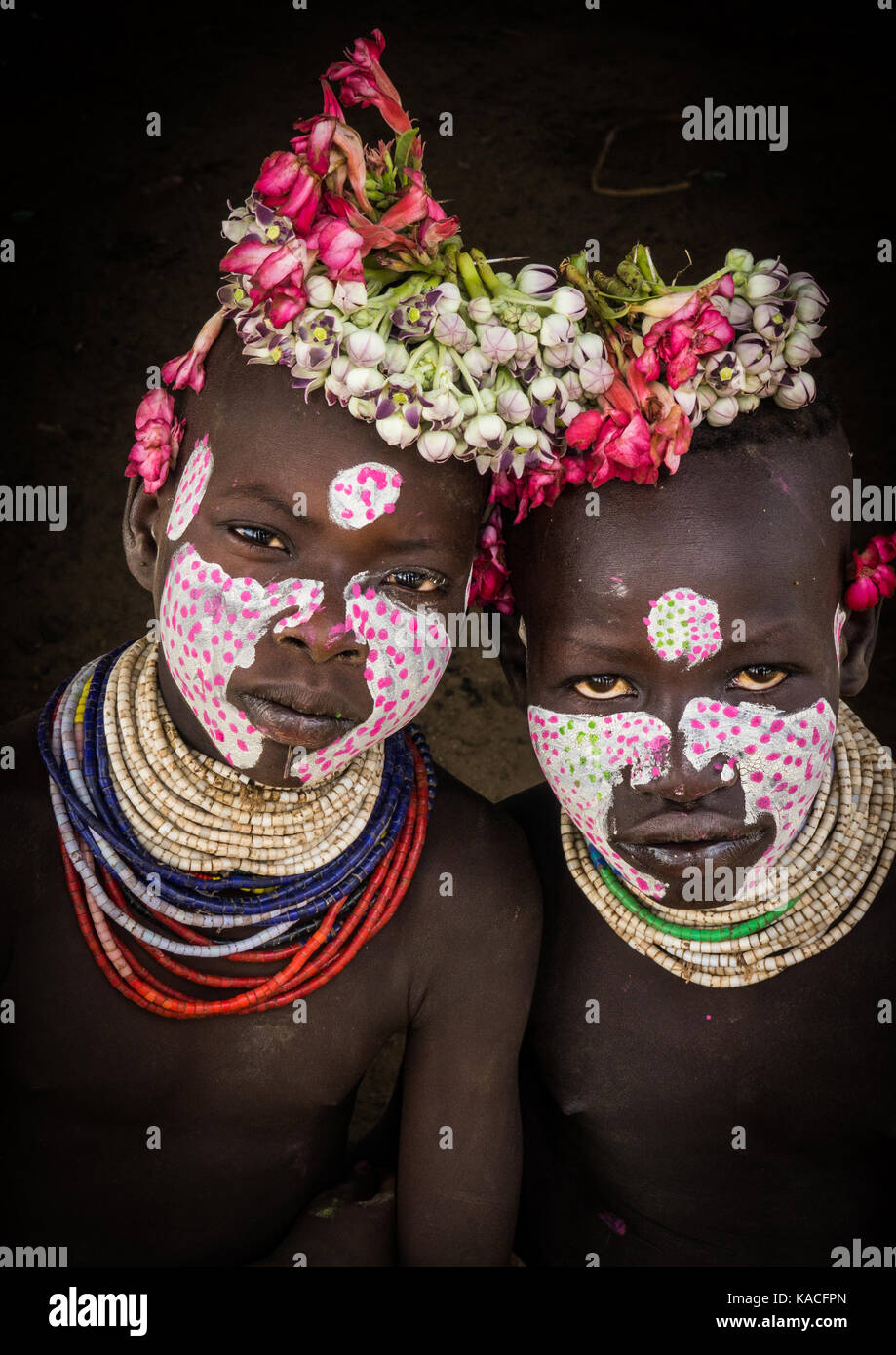 Karo tribe kids with flowers decorations, Korcho, Omo valley, Ethiopia Stock Photo