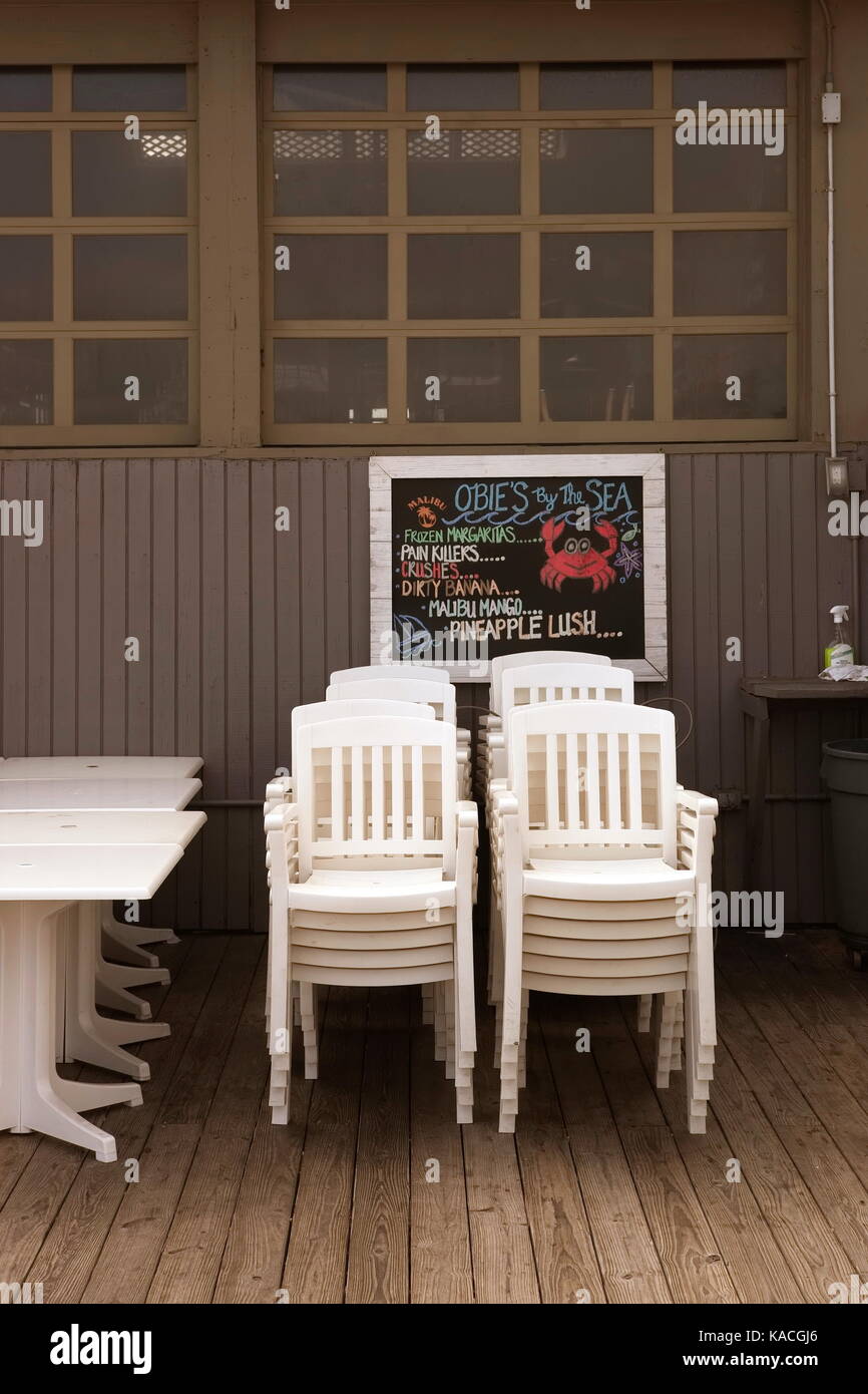 White Plastic Chairs Stacked In A Rehoboth Beach De Bar Closed