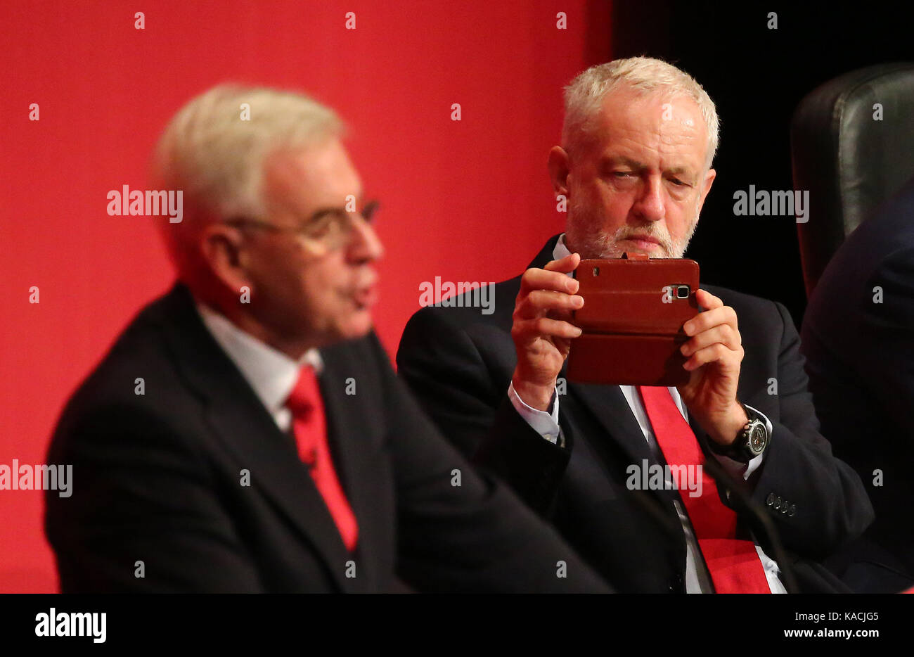 Labour leader Jeremy Corbyn takes a photography of Shadow Chancellor of the Exchequer John McDonnell. Stock Photo