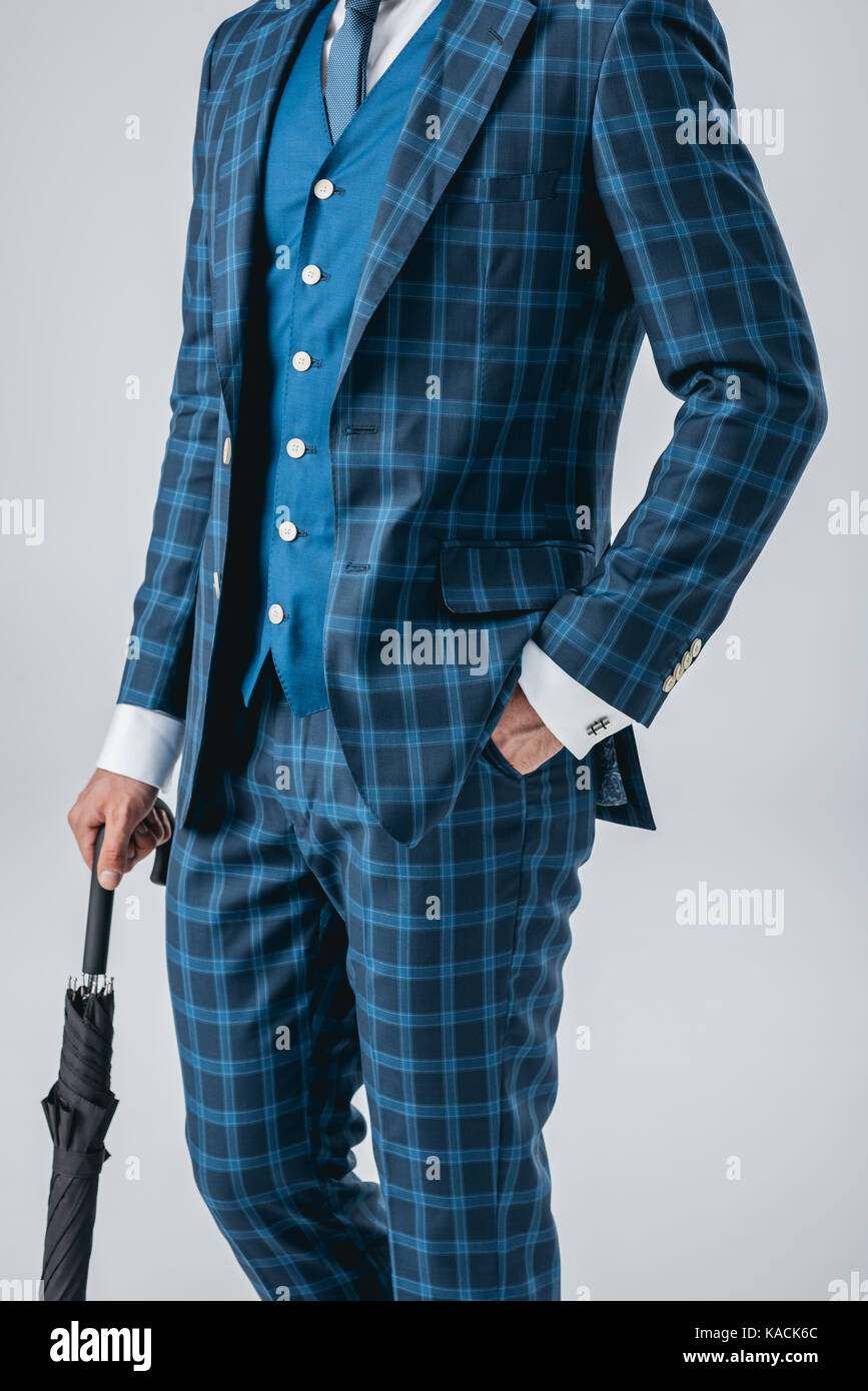 man in suit holding umbrella Stock Photo Alamy