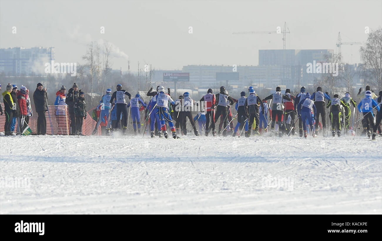 Mass start men athletes skiers during Championship on cross country
