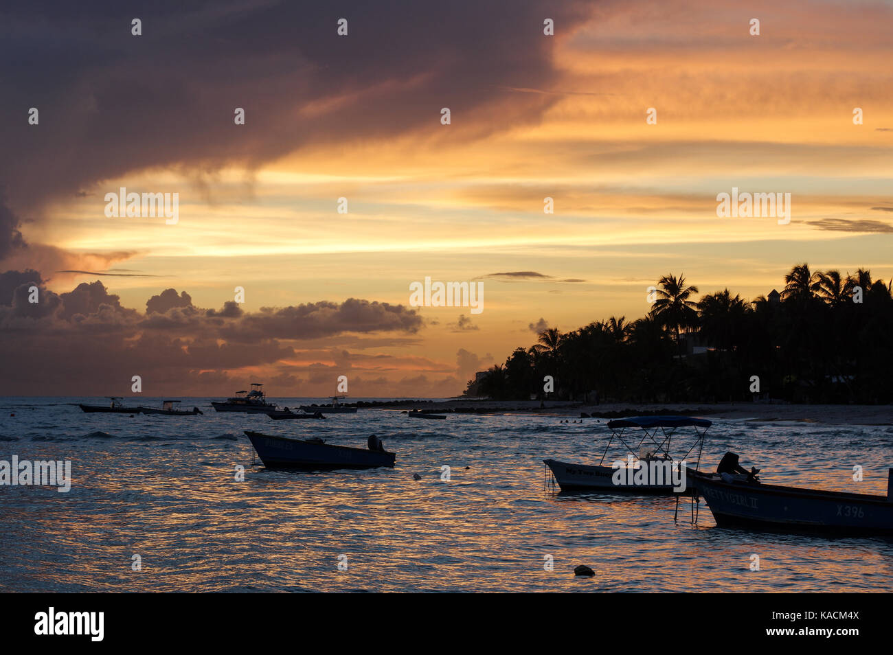 Sun setting over Worthing Beach on the west coast of Barbados Stock Photo