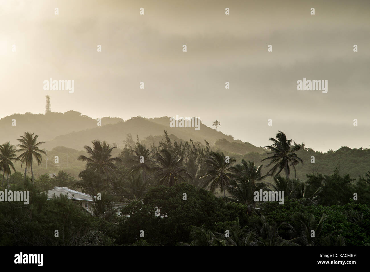 Dusk setting over the hillsides surrounding the fishing village of Bathsheba on the East Coast of Barbados Stock Photo