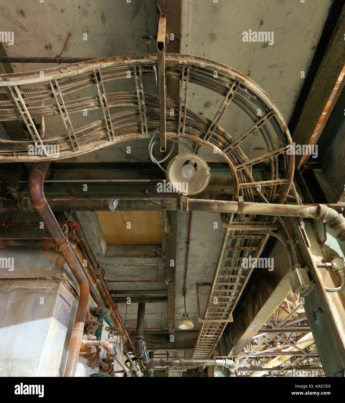 LAN conduit tray dominates ceiling of gallery overlooking production area in E B Eddy paper mill, Ottawa, Canada, closed in 2007. Stock Photo