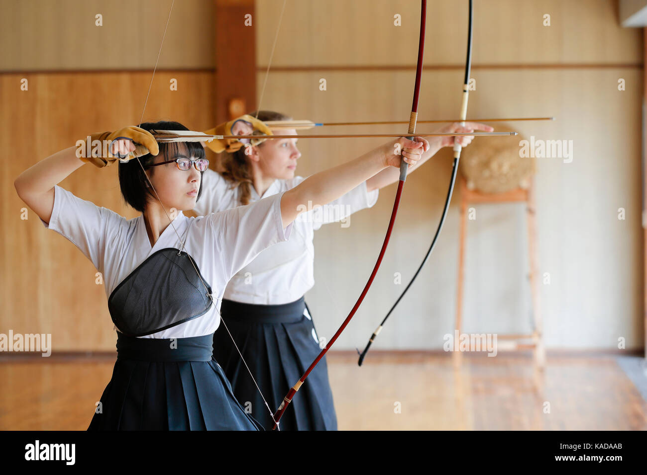 Multiethnic traditional Kyudo Japanese archery athletes practicing