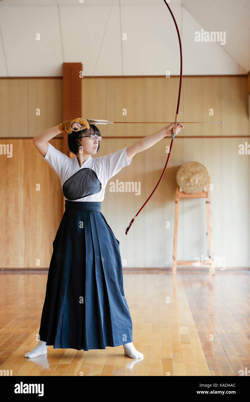 Japanese traditional Kyudo archery athlete practicing Stock Photo