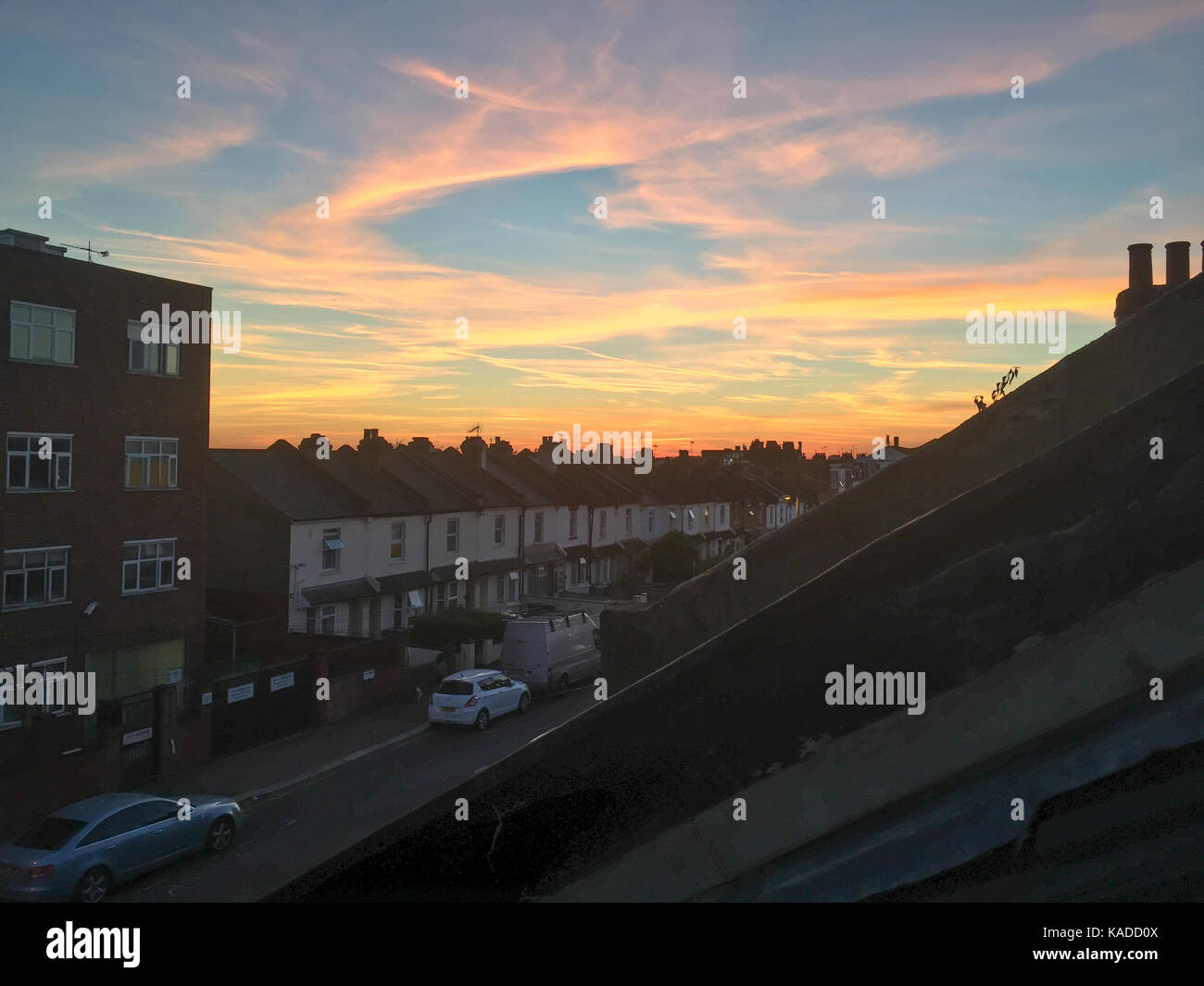 Beautiful sunset over a typical London street. North West London, England. Stock Photo