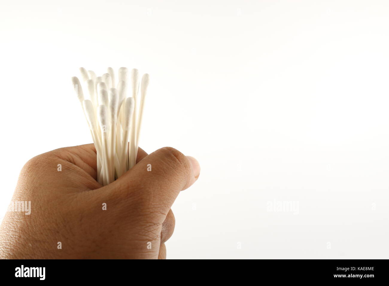 Hand Holding Cotton Bud Stock Photo