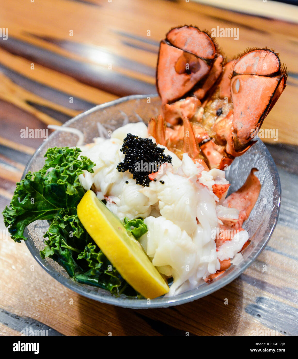 Lobster Sashimi with black tobiko (flying fish roe), lemon and kale