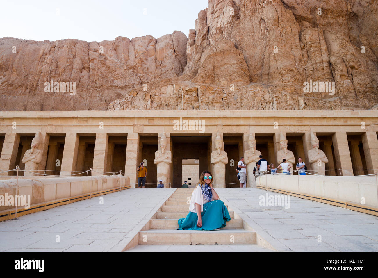 The girl sitting near the temple in Luxor, Egypt Stock Photo