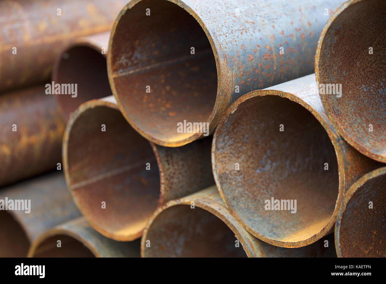 Metal profile pipe of round section in packs at the warehouse of metal ...