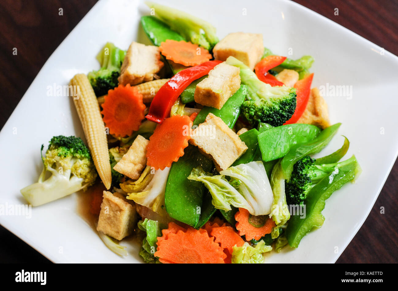 Stir-Fried Mixed Vegetables, Stir-fried broccoli, baby corn, carrots,  peapods, napa and bell pepper in a soy sauce Stock Photo - Alamy