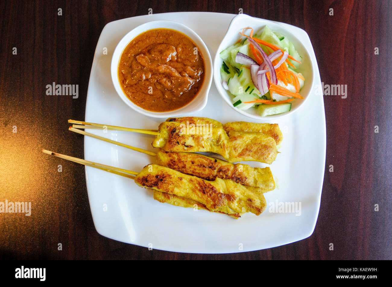 Chicken Satay, Marinated chicken grilled on skewers, served with peanut